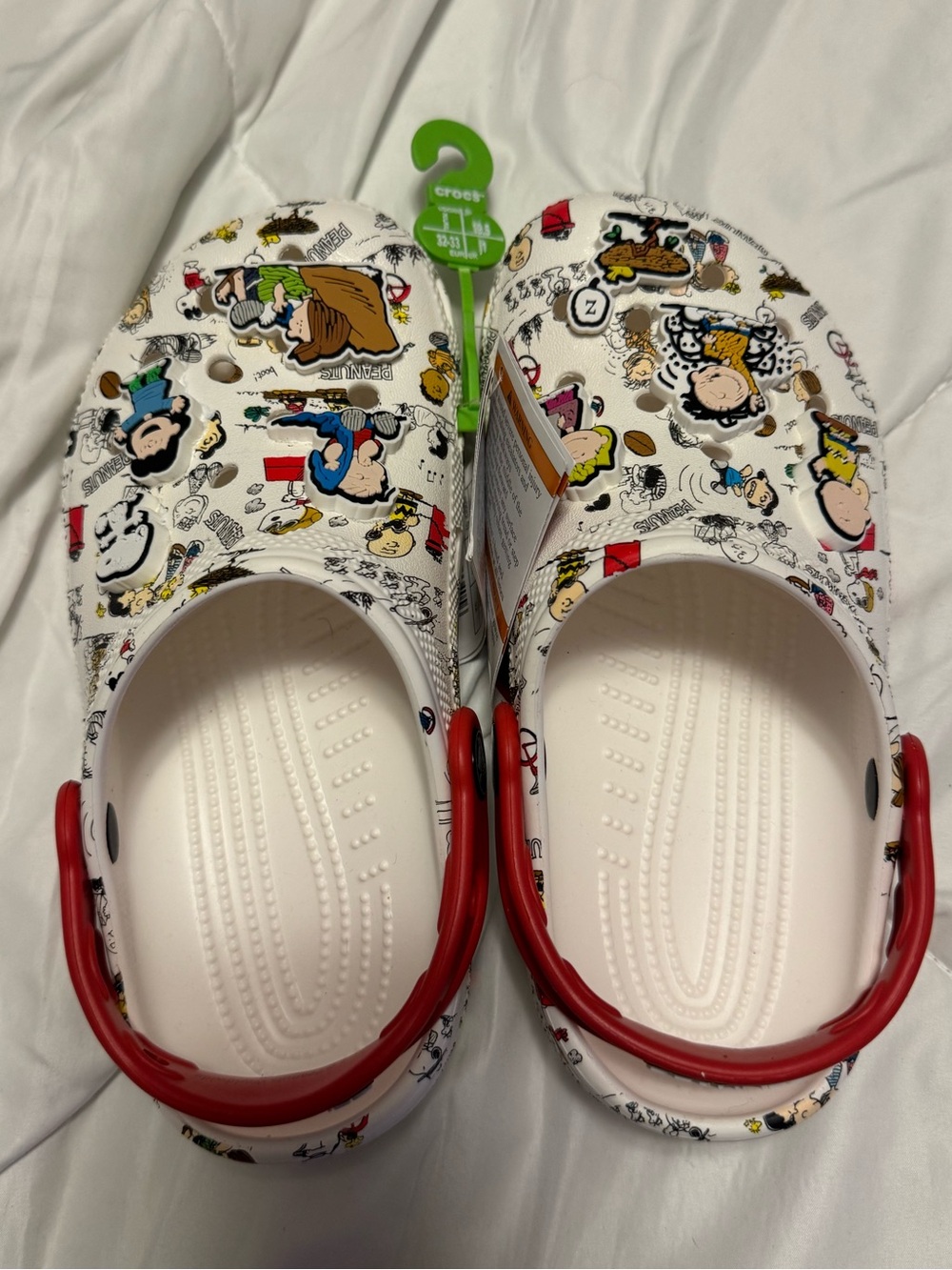 CROCS White Kids' Peanuts Print Clogs with Red Heel Strap